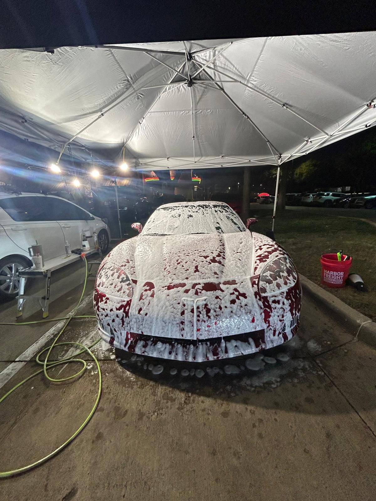 A corvette being foam washed